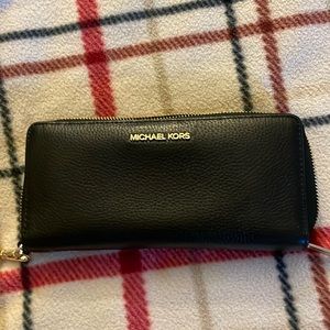 Michael Kors Leather wallet/clutch black. Gently used. iPhone 12 Pro fits inside
